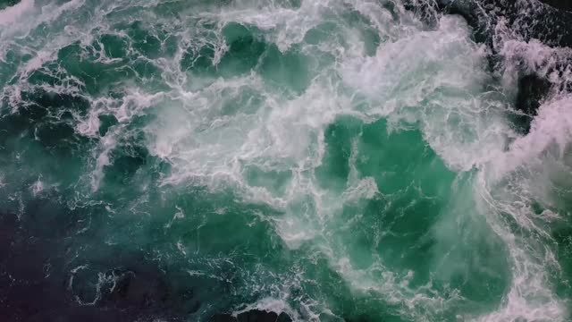 waves of water of the river and the sea meet each other during high tide and low tide whirlpools