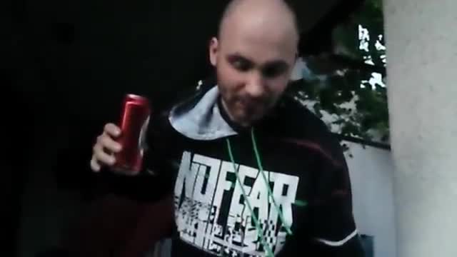 Guy drinks from an ashtray.