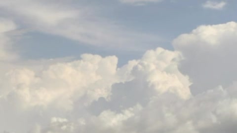 Cloud filled sky above a hill