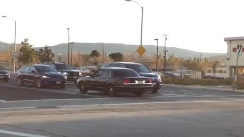 Car in reverse at traffic light