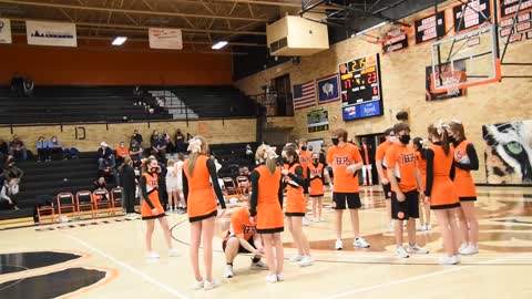 Cheer team performs during a timeout