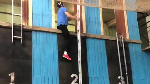 Competitive Firefighter Climbs Up Ladder