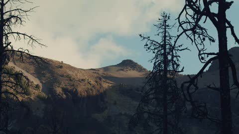 Timelapse of the sky behind a mountain