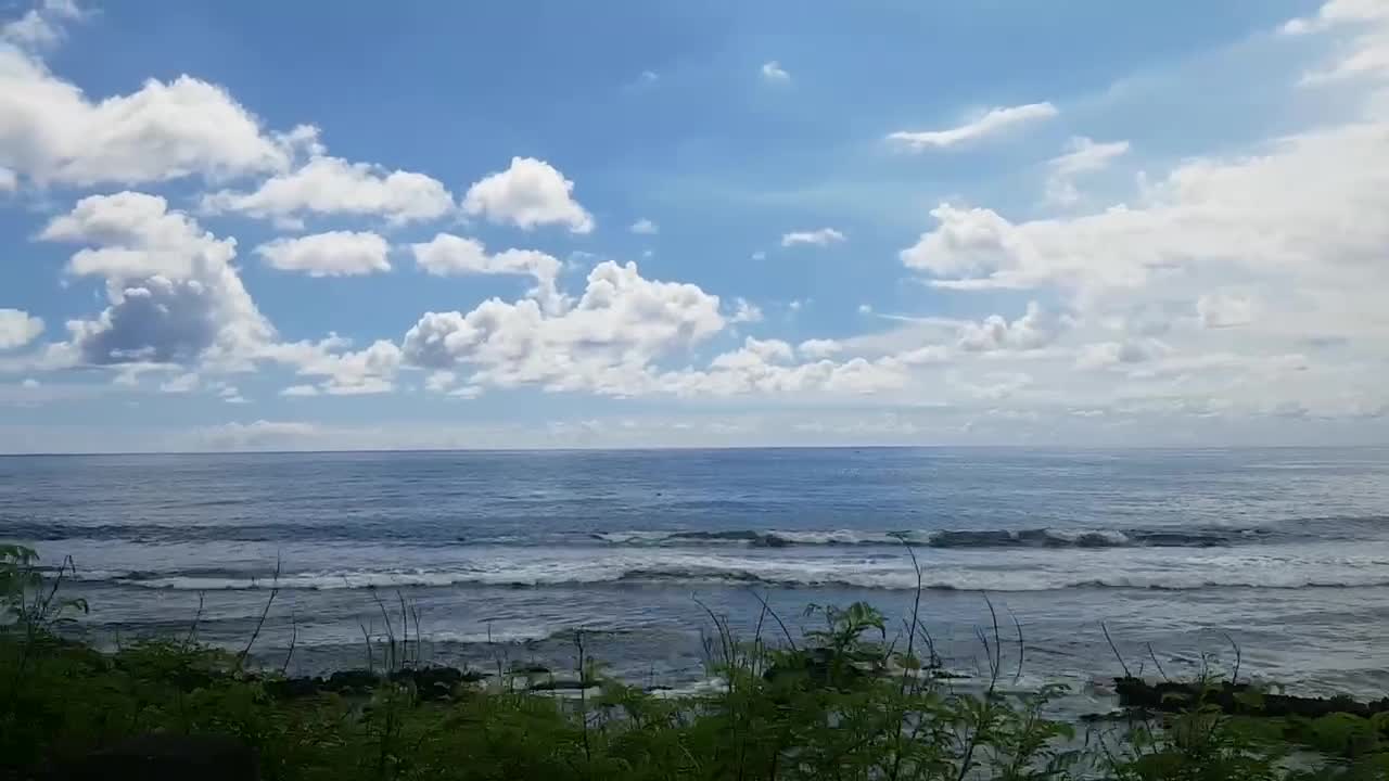 The sky is full of clouds. Drive right next to the sea.