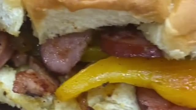 A cheesy bacon sandwich