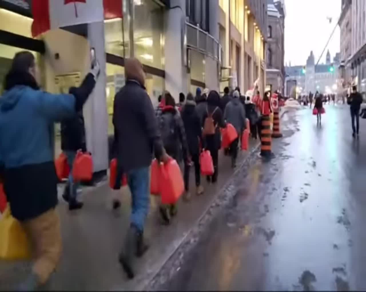 Canadians Carry Empty Jerry Cans Through Ottawa Streets