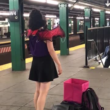 Woman red wings sings opera