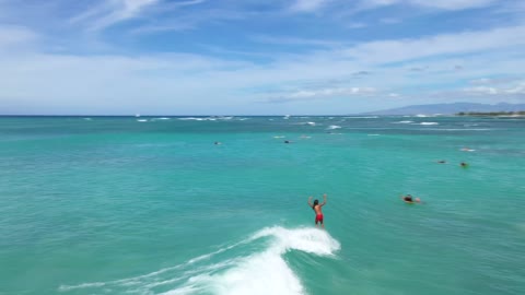 Surfers Surfing in the Ocean