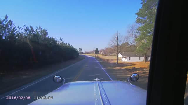 Truck crashes into side of house