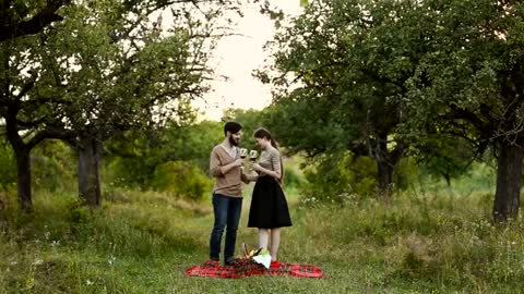 Couple modeling by a cabin