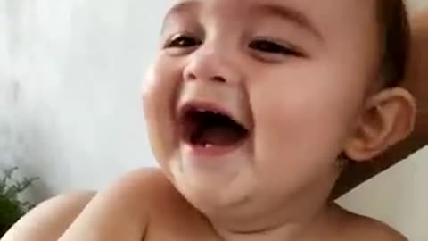 Baby laughing contagiously and hot