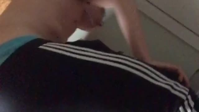 Guy in black pants throwing up in bedroom