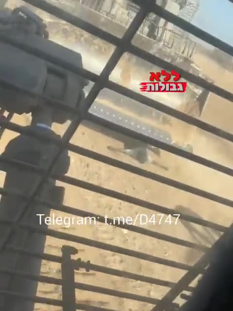 terrorist Israeli army bulldozer deliberately runs over a dead Palestinian in Gaza