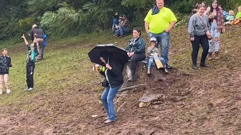 Woman Slips on Muddy Slope