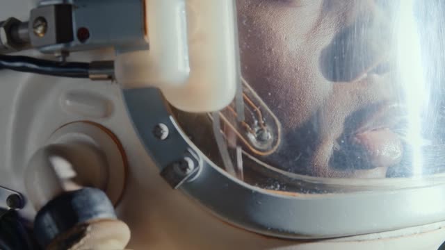 a-woman-wearing-a-space-helmet-