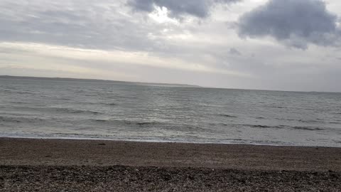 On the beach on windy day . Hiking