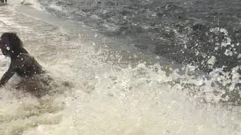 Lady Posing for Picture Surprised by Big Wave