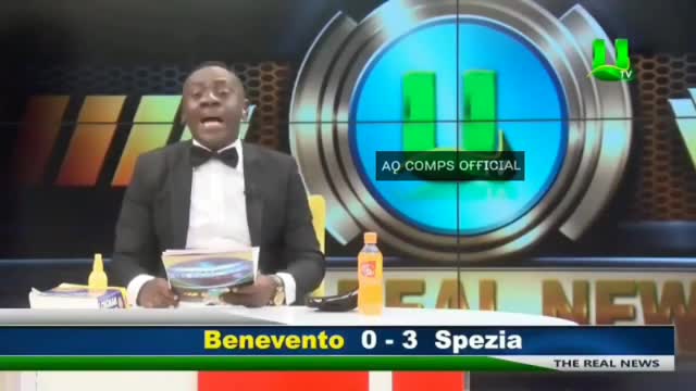 An African Man Reading The Football Results