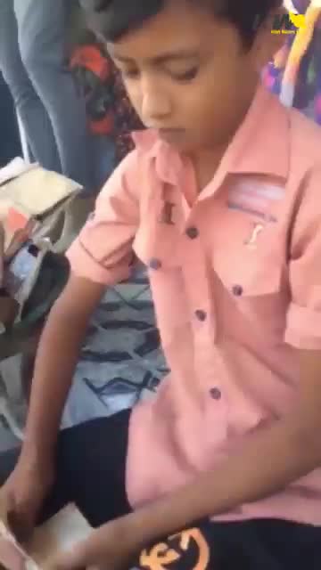 Iran: Child worker sifts through trash for recyclables