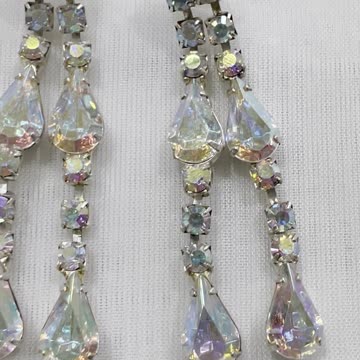 Silver Plated 2.5” Drop Earrings. Made with Swarovski Crystal AB. Post Earrings