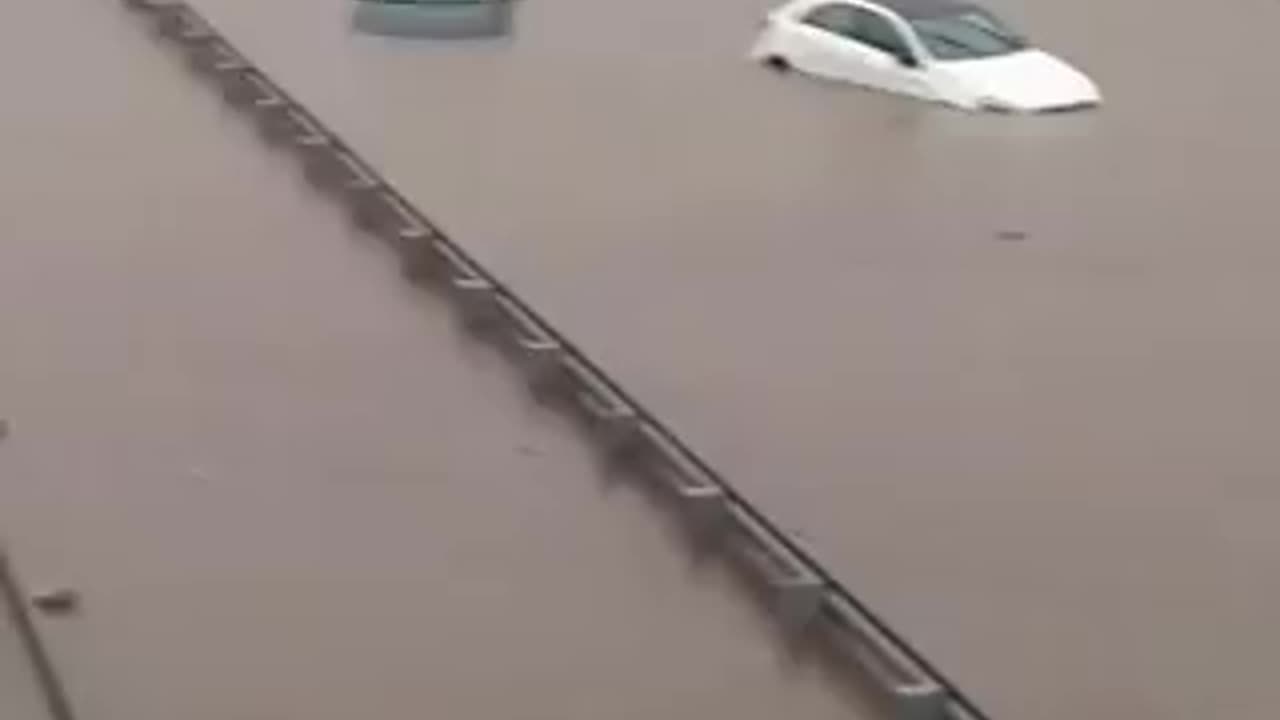 Vehicles submerged in floodwaters on C-32, linking Barcelona to the airport, amid flooding in Spain