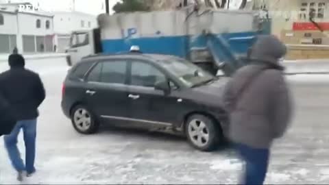 Ice Ice Baku_ cars and buses negotiate ice covered road in Azerbaijan