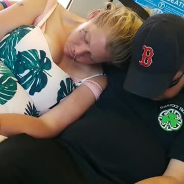 Man and women asleep on train boogers coming out of nose