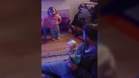 Cute baby fighting with dad for the name of Disney frozen