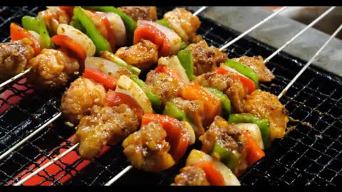 Vegetables and meat skewers in a barbecue, a special flavor