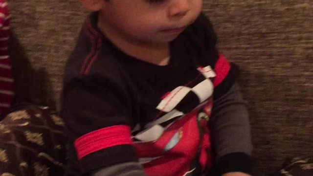Cute 2 year old baby boy on tablet