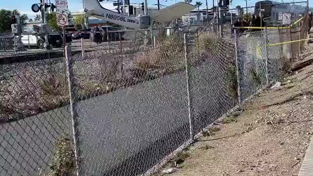 L.A. Police Save Pilot Stuck on Railroad Tracks Right Before Train Hits Plane