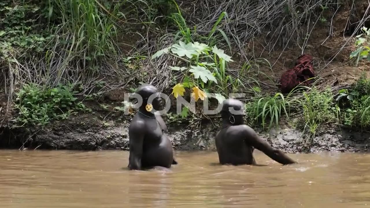 black men african washing in river africa pride