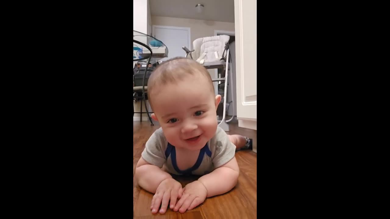 Funny baby steals his mom's cell phone