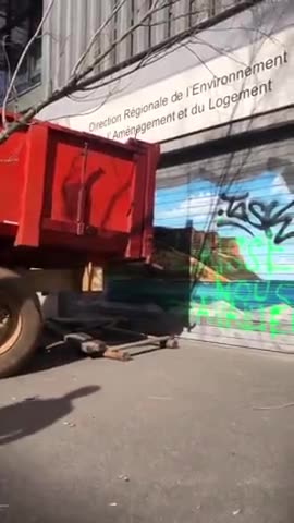 French farmers smash into the Environment, Planning, and Housing office in Marseille.
