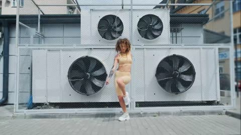 The women are sexy when performing dance on the rooftop