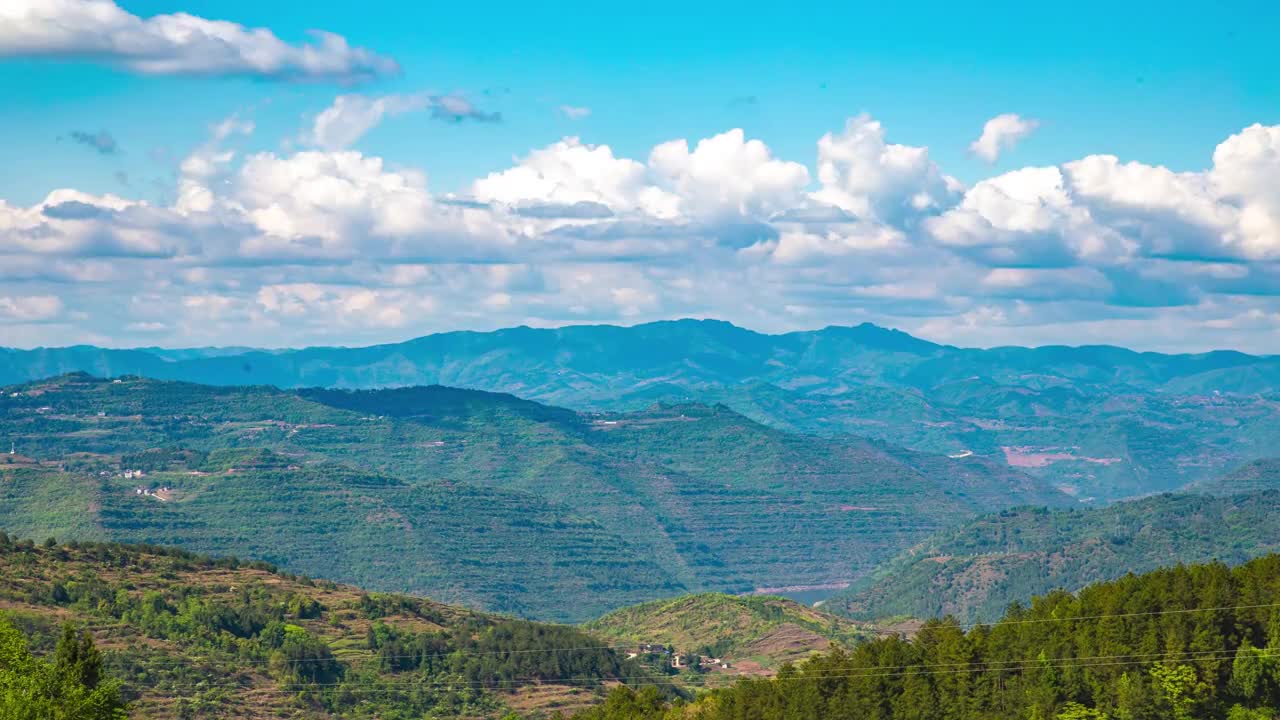 Beautiful countryside under blue sky and white clouds in summer