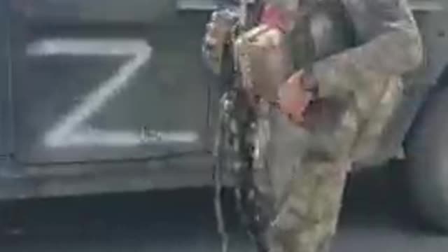 Ukraine War - A Chechen soldier and a captured Humvee from Lisichansk