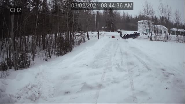 Driver Flips Car on Icy Road