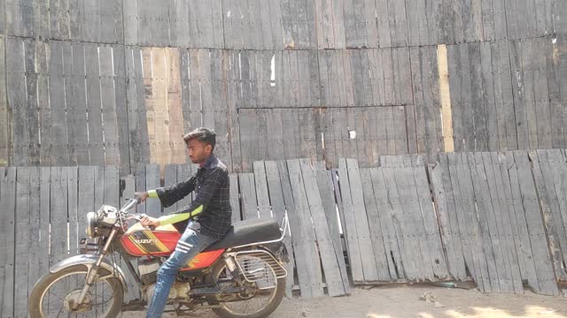 Wall of Death. Bike Stunt. Stunt man on bike.