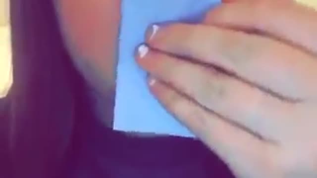 Girl sucks in blue paper
