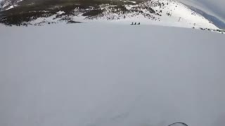 First person man tumbles in snow after skiing