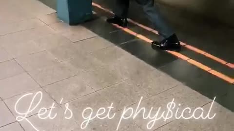 Guy in suit uses briefcase as arm weights