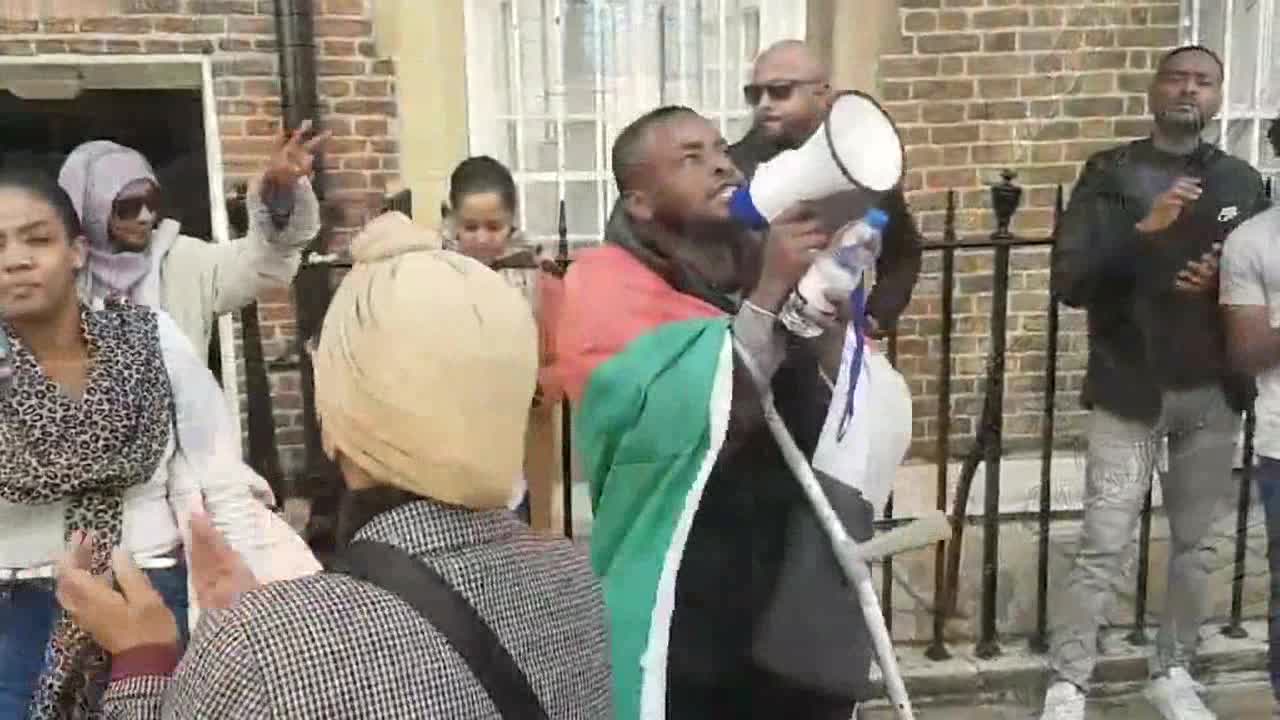 Demonstrators gather outside Sudanese embassy in London after military coup