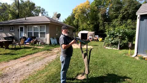 shooting at ping pong balls with a trad bow