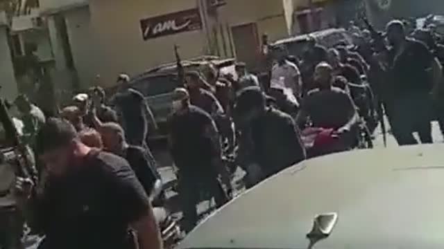 Hundreds of Hezbollah militants make a pilgrimage from Shiite villages