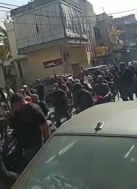 Hundreds of Hezbollah militants make a pilgrimage from Shiite villages