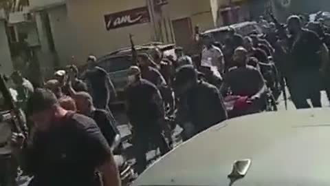 Hundreds of Hezbollah militants make a pilgrimage from Shiite villages