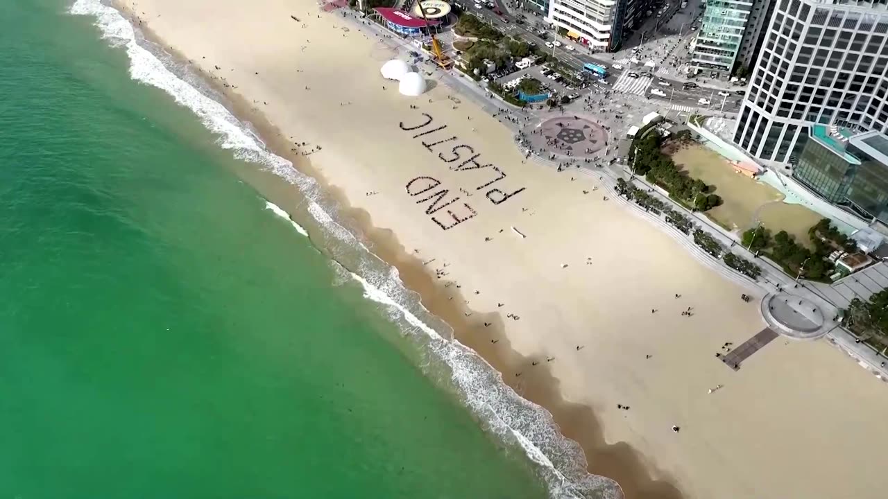 Activists form giant sign to 'end plastic' ahead of UN talks