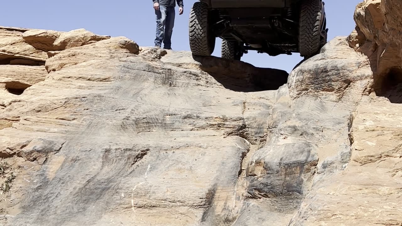 SUV Goes Down Steep Slope