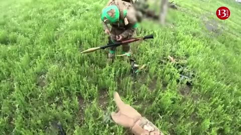 -Ukrainian fighters display the killed Russians and the captured weapons near Bakhmut(720p)